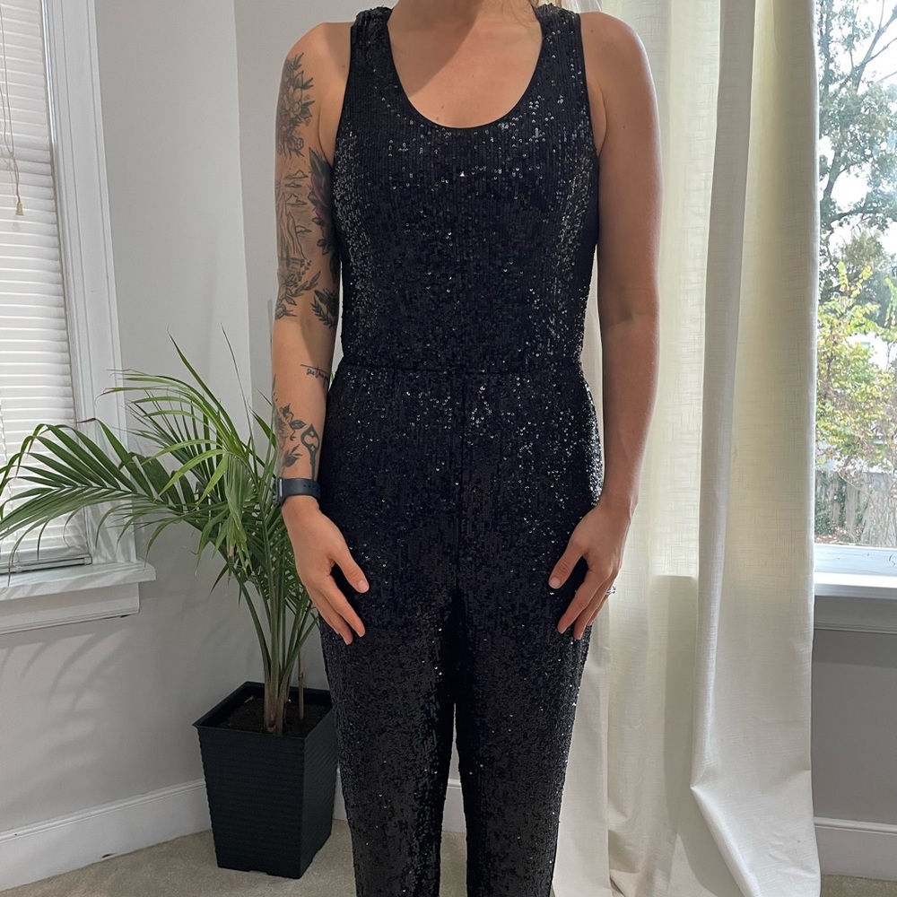 Express black sequin jumpsuit. Size small. Stretchy waistband.